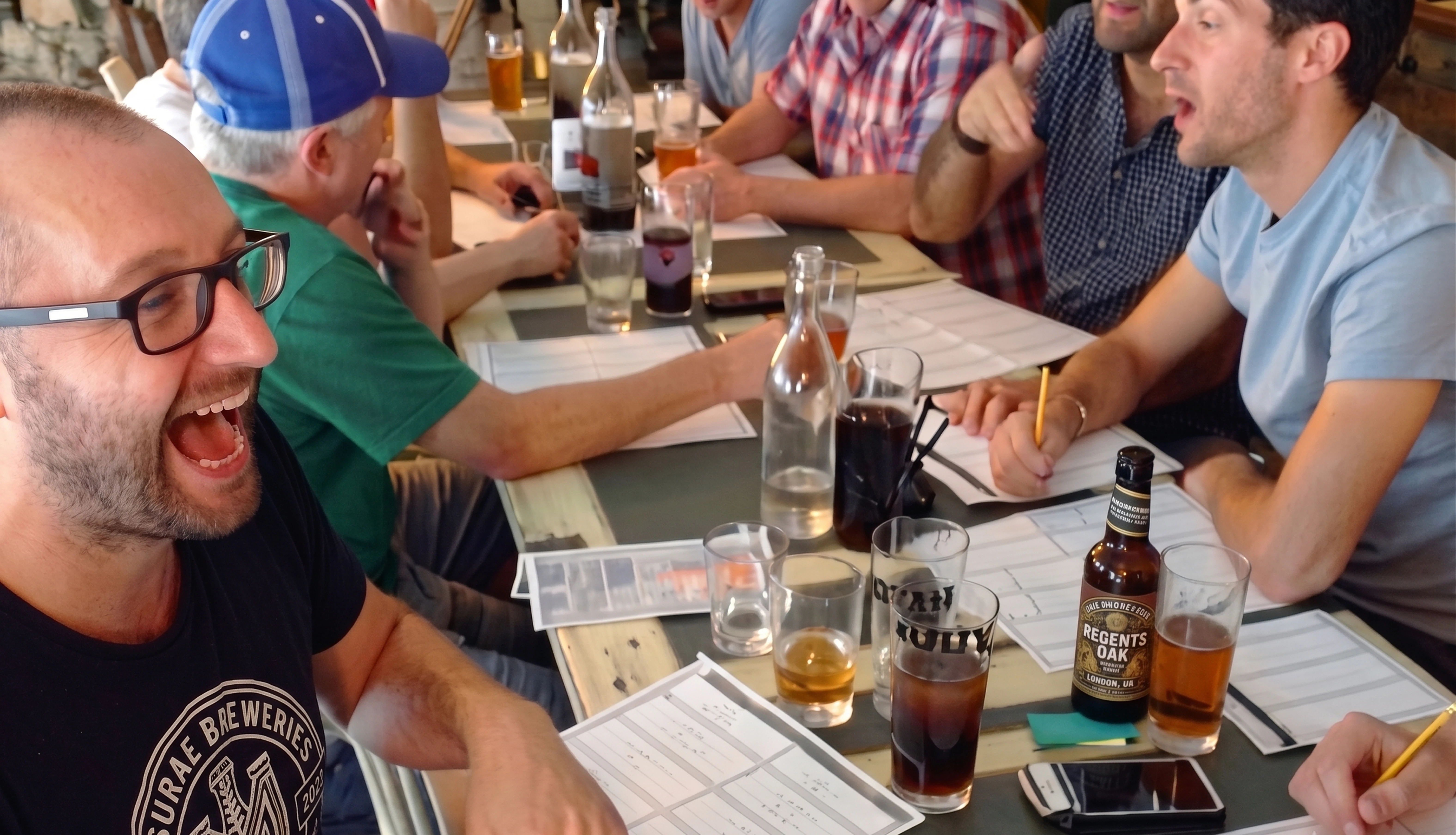 Friends bidding for players around the table at a league auction